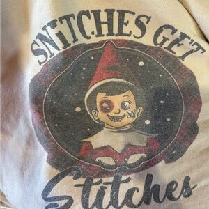 Gildan Cream Sweatshirt with Red and Black Graphic "Snitches Get Stitches"
